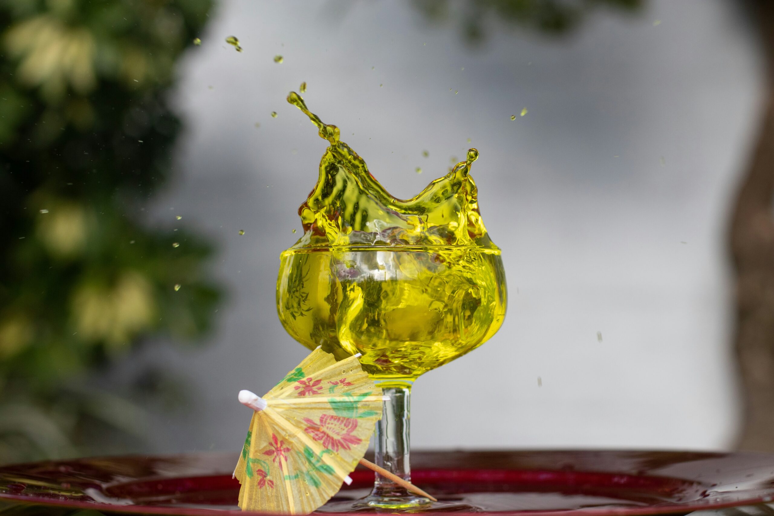 A golden retriever playing with an artistic glass creation orb