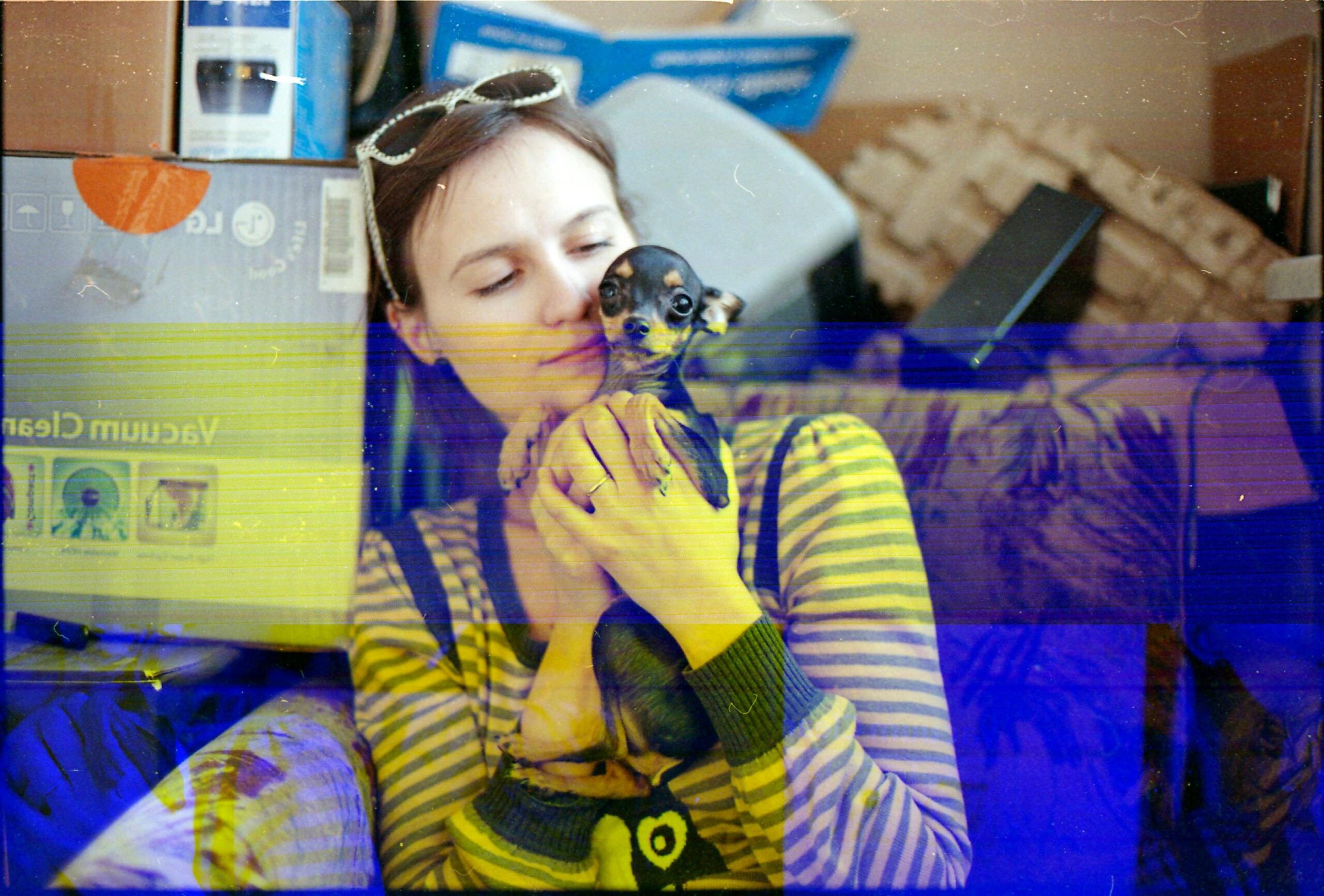 Pet owner smiling holding freshly cleaned glass toys