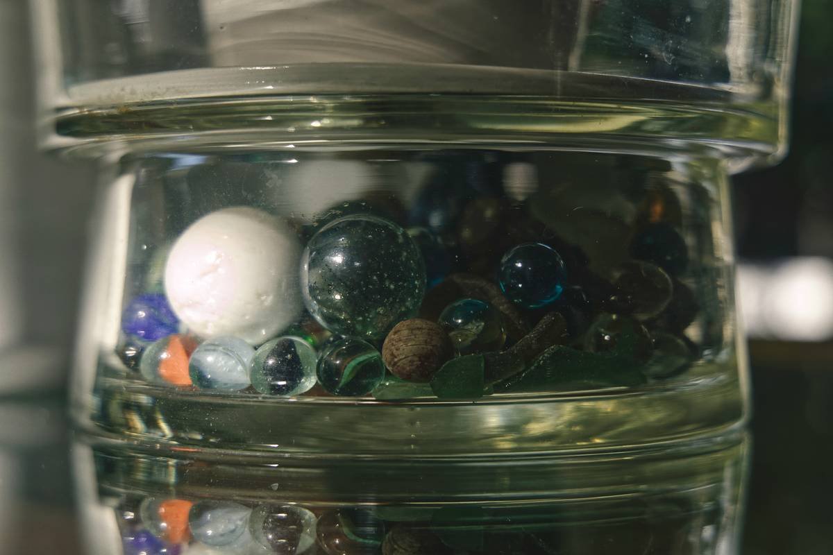 Close-up shot of a glass toy being inspected for cracks