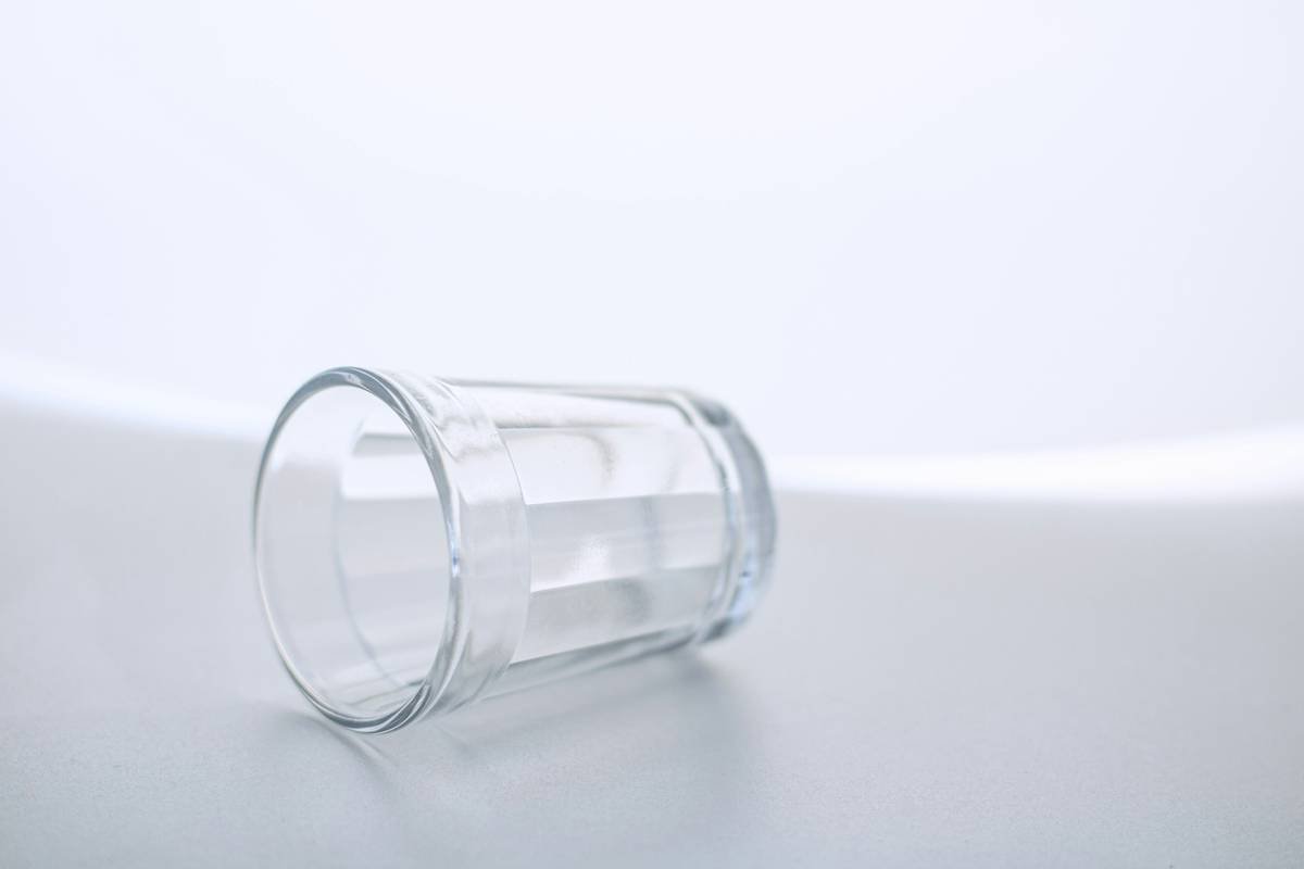 A beautifully designed glass toy on a wooden table