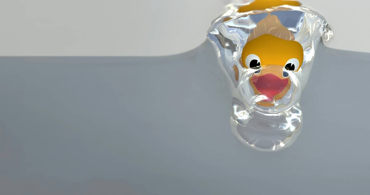 Infographic showing biofilm buildup on glass pet toys vs. clean surface under microscope