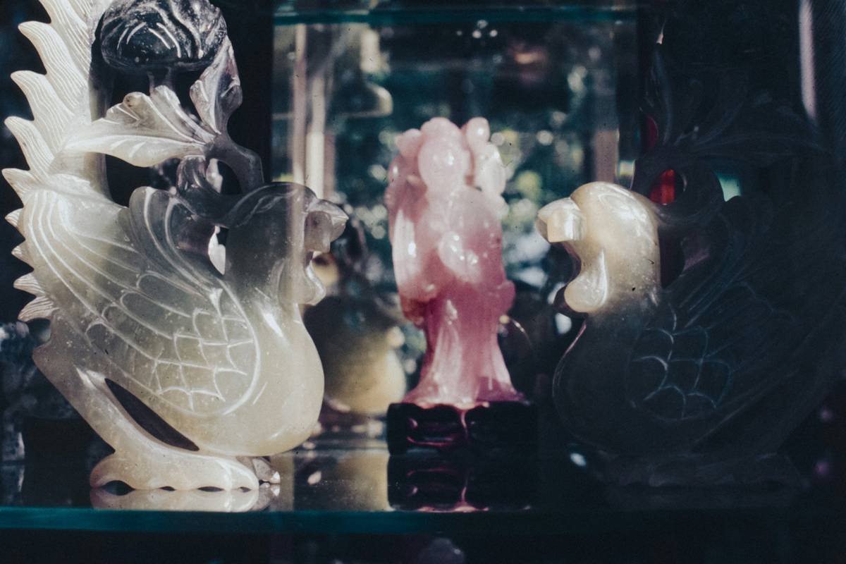 Side-by-side comparison: fragile decorative glass figurine vs. vet-approved silicone animal toy with reflective coating